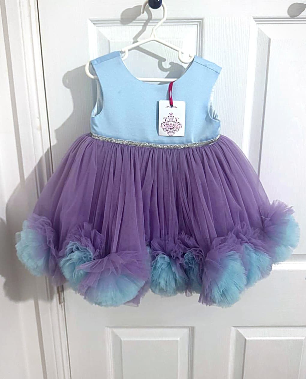 The Posy lilac and aqua pom-pom party dress, front